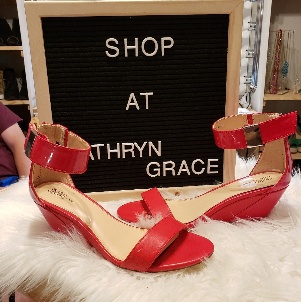 Red sandals with silver buckle